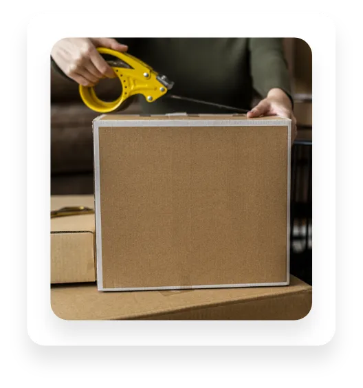 person taping box